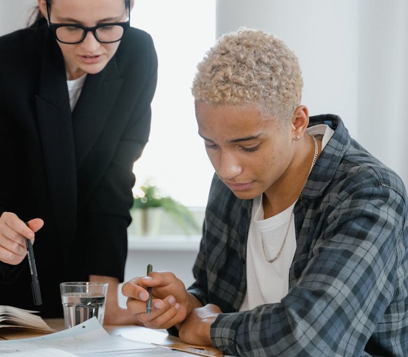 Finance mentor teaching young professional